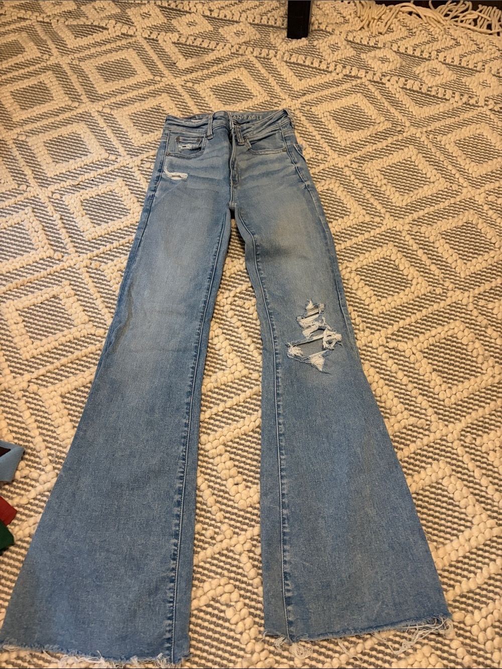 American Eagle Outfitters Light Blue High-Rise Flared Jeans with Distressed Knee